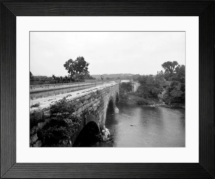 Framed Print : Canal boat passing through an Aqueduct over the Potomac River at Williamsport Maryland in 1903. Four mules are pulling the boat are attended by their driver. LC-D4-16566 Framed Print : Canal boat passing through an Aqueduct over the Potomac River at Williamsport Maryland in 1903. Four mules are pulling the boat are attended by their driver. LC-D4-16566
