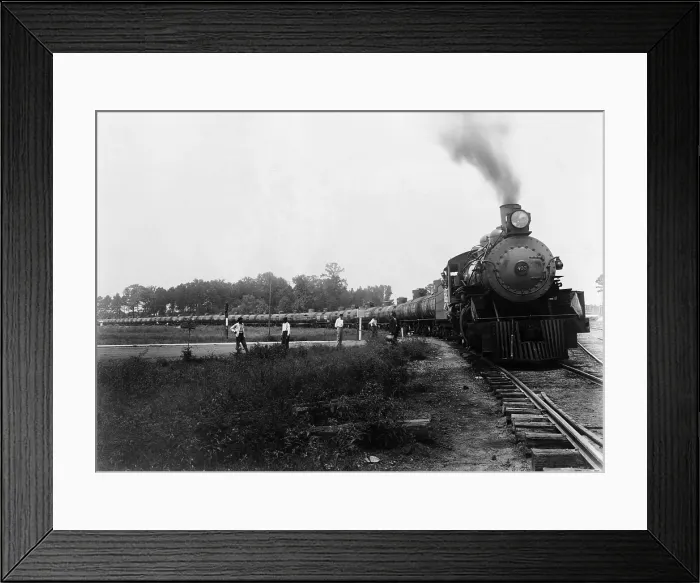 Framed Print : Pedestrians waiting at a railroad crossing for Louisiana Arkansas Railroad train pulling tank cars to pass. Ca. 1920-1940. LC-USZ62-106094 Framed Print : Pedestrians waiting at a railroad crossing for Louisiana Arkansas Railroad train pulling tank cars to pass. Ca. 1920-1940. LC-USZ62-106094