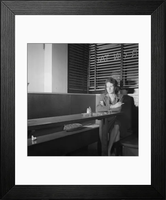 Framed Print : Young woman sitting alone in a Washington, D.C. bar, April 1943. She came to the Sea Grill pretty often, hoping to meet a nice lonesome soldiers