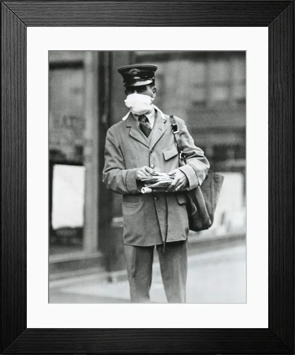 Framed Print : Spanish Flu Epidemic 1918-1919 in America. Letter carrier in New York City wearing a gauze mask to avoid catching influenza. Oct. 16, 1918 (BSLOC_2016_11_109)