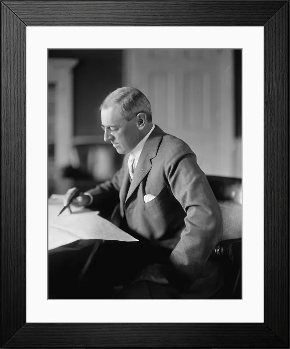 Framed Print : President Woodrow Wilson, seated at his desk in the Oval Office, White House, c. 1913-1916 (BSLOC_2016_11_10)