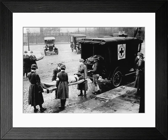 Framed Print : Spanish Flu Epidemic 1918-1919 in America. Masked American Red Cross Motor Corps women carry a man to an ambulance on a stretcher. St. Louis, Missouri, Oct