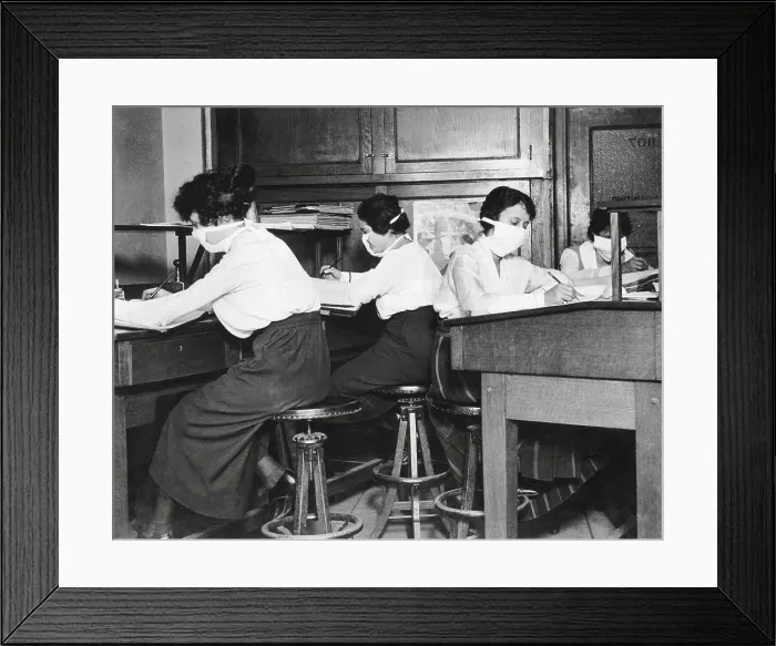 Framed Print : Spanish Flu Epidemic 1918-1919 in America. Young women office workers with gauze mask carefully tied about their faces to protect against the spread of influenza. Oct Framed Print : Spanish Flu Epidemic 1918-1919 in America. Young women office workers with gauze mask carefully tied about their faces to protect against the spread of influenza. Oct