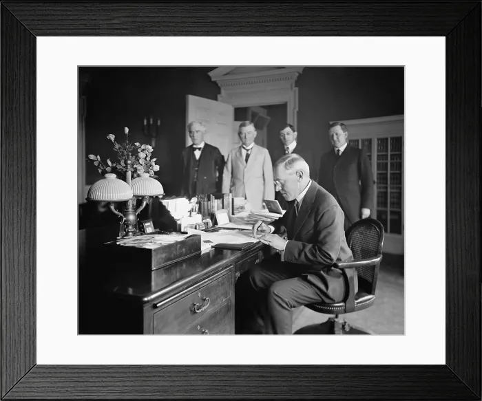 Framed Print : President Woodrow Wilson, signing the San Diego Expo Bill in the Oval Office, White House. By pushing a telegraph button in Washington, D.C. on Dec