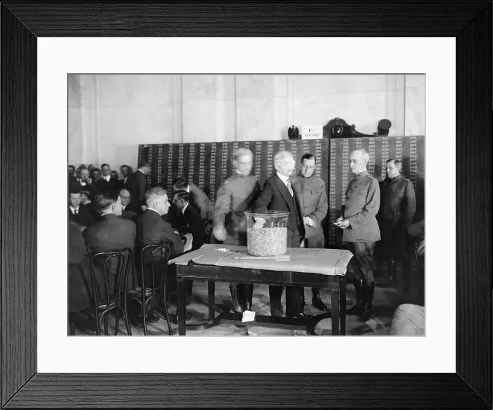 Framed Print : Vice President Thomas R. Marshall, wearing a blindfold, draws a draft lottery capsule during WW1, 1918