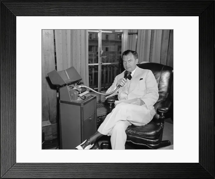 Framed Print : Attorney Gen. Robert H. Jackson, speaking into a Dictaphone on July 12, 1940. Dictaphones were voice recording devices invented in the 1880