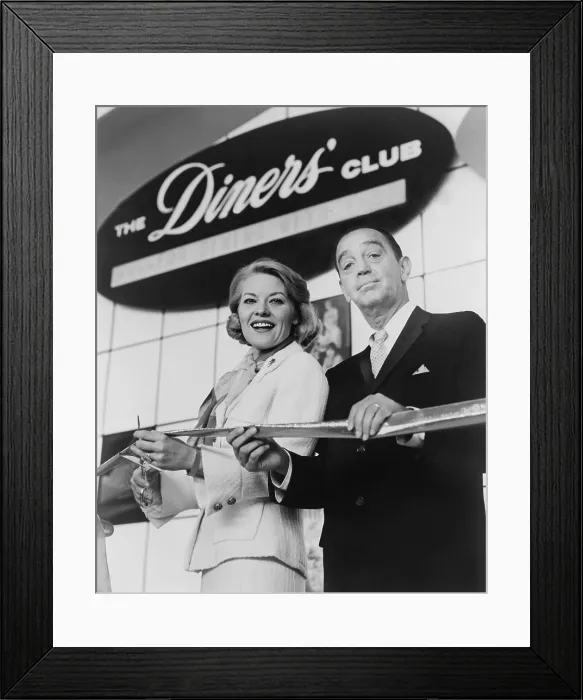 Framed Print : Ralph Schneider assists Patti Page cutting ribbon to open Diners Club exhibit at 1964 World's Fair. Diners Club was the first independent credit card company in 1950