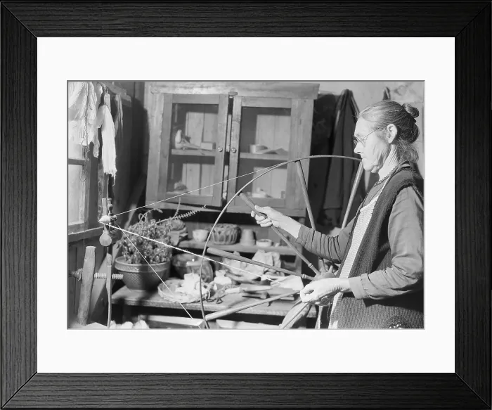 Framed Print : Elderly woman spinning yarn in her cabin near Gatlinburg, Tennessee, Nov. 1933. Located in the Great Smoky Mountains, she lived in a world little changed from the 19th century