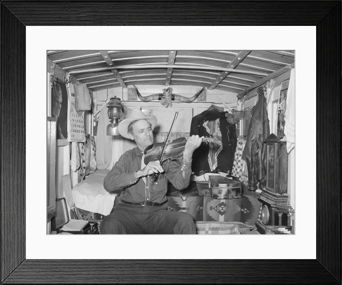 Framed Print : Mr. Bias playing the fiddle in his trailer home. He is a former cowboy who travels the country living on a small private income. Weslaco, Texas. Feb. 1930 (BSLOC_2015_14_145)