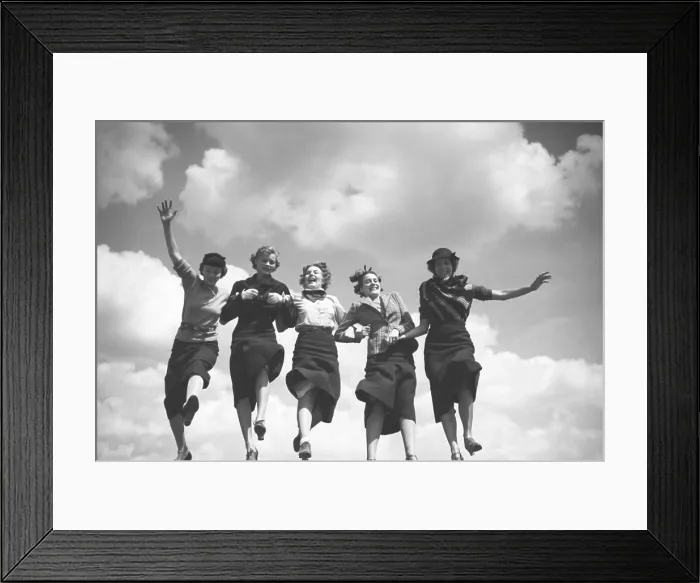 Framed Print : Five fashion models holding hands and walking in a row with the sky as backdrop. August 1935, by Toni Frissell. (BSLOC_2015_14_146) Framed Print : Five fashion models holding hands and walking in a row with the sky as backdrop. August 1935, by Toni Frissell. (BSLOC_2015_14_146)