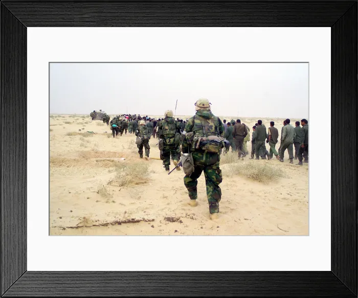 Framed Print : U.S. Marines escort captured enemy prisoners of war to a holding area in the desert of Iraq on March 21 2003 during Operation Iraqi Freedom. (BSLOC_2011_3_35) Framed Print : U.S. Marines escort captured enemy prisoners of war to a holding area in the desert of Iraq on March 21 2003 during Operation Iraqi Freedom. (BSLOC_2011_3_35)