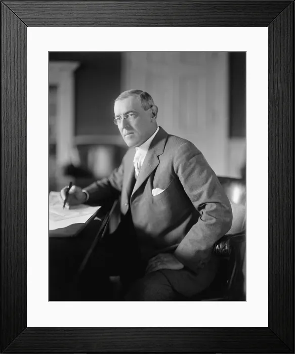 Framed Print : President Woodrow Wilson, seated at his desk in the Oval Office, White House, c. 1913-1916 (BSLOC_2016_11_9)