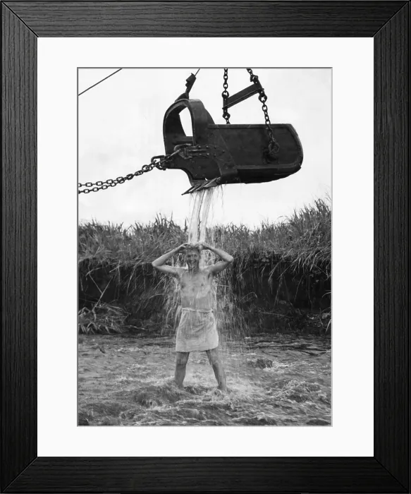Framed Print : U.S. Marine officer enjoys an early morning shower at Cape Gloucester on New Britain. Water is provided by friendly steam shovel operator, May 10, 1944. - (BSLOC_2014_14_15) Framed Print : U.S. Marine officer enjoys an early morning shower at Cape Gloucester on New Britain. Water is provided by friendly steam shovel operator, May 10, 1944. - (BSLOC_2014_14_15)