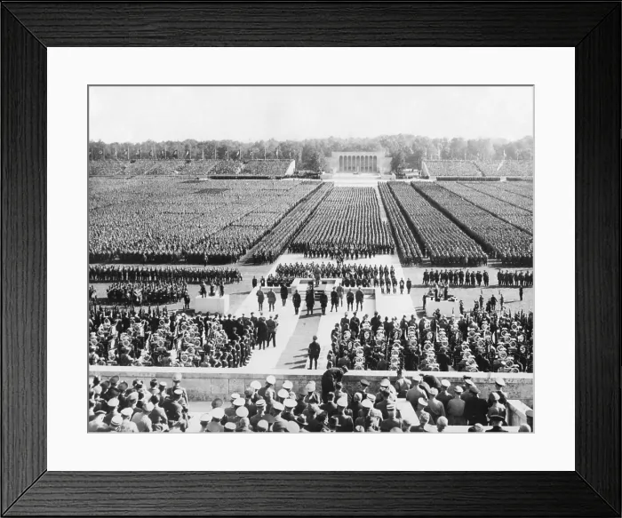 Framed Print : Ranks of the Nazi German army fill Zeppelin Field in Nuremberg. They are addressed by Hitler from a podium (center) during the Nazi Party Congress, Sept. 8, 1938