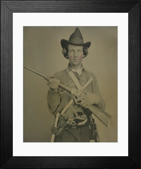 Framed Print : Cavalry soldier wears a Confederate uniform, possibly from Kansas or Missouri. He is armed with a slant breech sharps carbine, two knives, and two revolvers Framed Print : Cavalry soldier wears a Confederate uniform, possibly from Kansas or Missouri. He is armed with a slant breech sharps carbine, two knives, and two revolvers