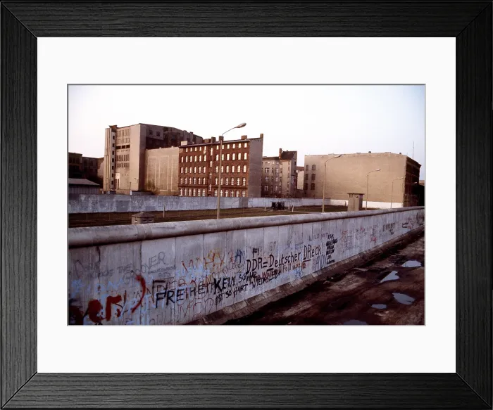 Framed Print : The Berlin Wall separated Communist-controlled East Germany from West Berlin. Graffiti marks the West Berlin side while the East side remains spotless. June 1 1983
