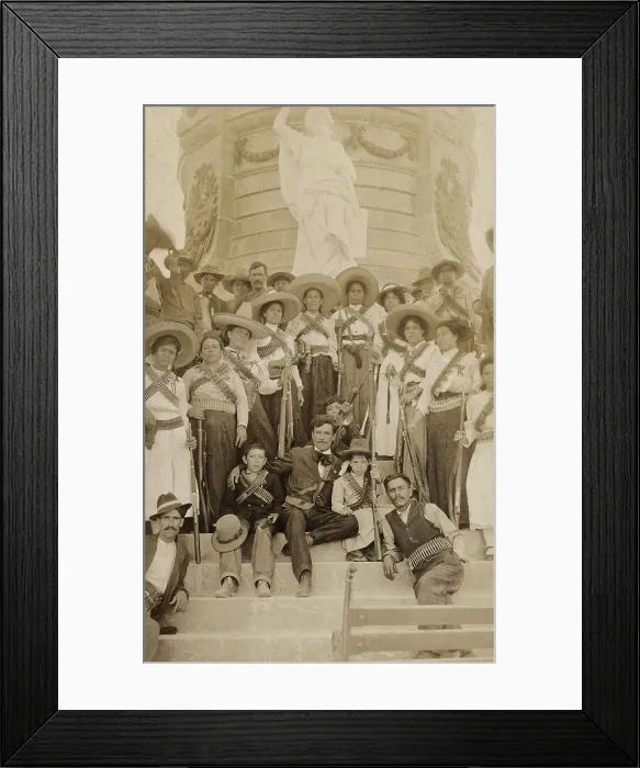 Framed Print : Journalist Lazaro Gutirrez de Lara surrounded by women Mexican revolutionary soldiers. They pose on the base of the Benito Juarez monument in Juarez, Mexico, c