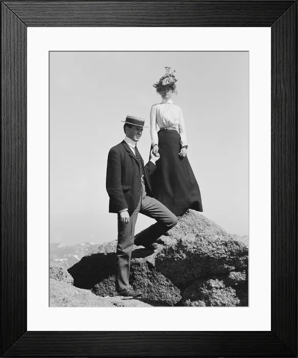 Framed Print : Young couple holding hands while posed on mountain rocks, c. 1900-1910 (BSLOC_2018_3_82)