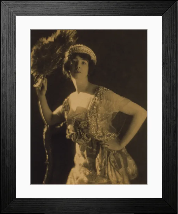 Framed Print : Gertrude Vanderbilt Whitney wearing a jeweled gown and tiara, while holding a peacock feather fan Framed Print : Gertrude Vanderbilt Whitney wearing a jeweled gown and tiara, while holding a peacock feather fan