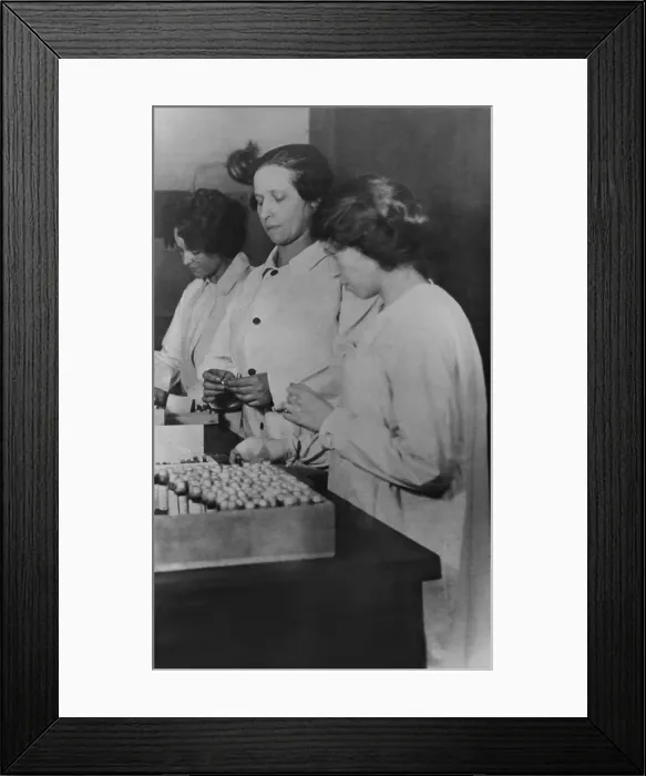 Framed Print : Spanish Flu Epidemic 1918-1919 in America. Three women packing influenza antitoxin for shipment to American cities during the epidemic, c. 1920 (BSLOC_2016_11_120) Framed Print : Spanish Flu Epidemic 1918-1919 in America. Three women packing influenza antitoxin for shipment to American cities during the epidemic, c. 1920 (BSLOC_2016_11_120)