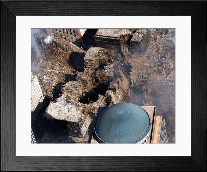 Framed Print : Ground Zero in New York City. The blue dome of the damaged World Financial Center is next to the rubble of the World Trade Center following the 9 / 11 terrorists attacks. Sept