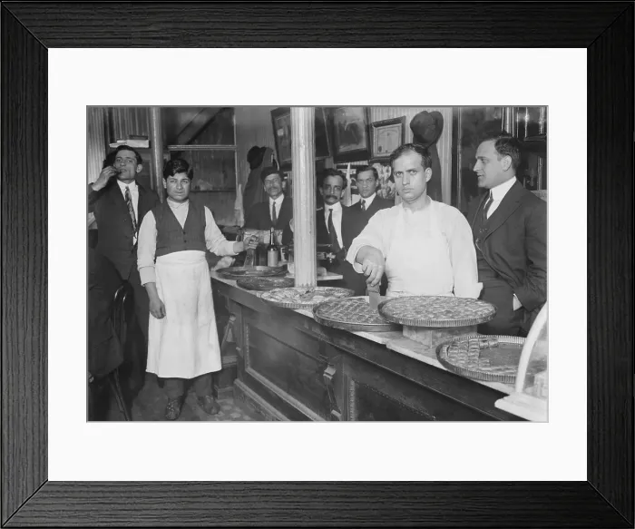Framed Print : Rich pastries on display in a Lebanese-Syrian restaurant in New York City. Many immigrants opened small businesses, including restaurants in their ethnic communities. Ca. 1910 Framed Print : Rich pastries on display in a Lebanese-Syrian restaurant in New York City. Many immigrants opened small businesses, including restaurants in their ethnic communities. Ca. 1910