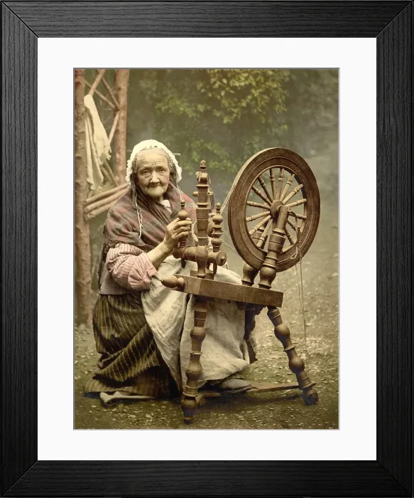 Framed Print : Elderly Irish Spinner working outdoors at her spinning wheel in the late 19th century Framed Print : Elderly Irish Spinner working outdoors at her spinning wheel in the late 19th century