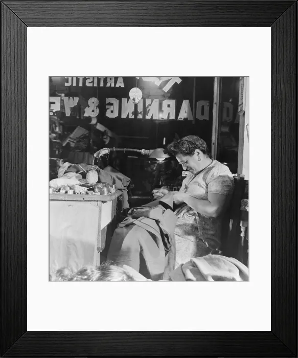 Framed Print : Proprietress of a Jewish weaving shop on Broom Street in the Lower East Side, the Jewish neighborhood of New York City. August 1942