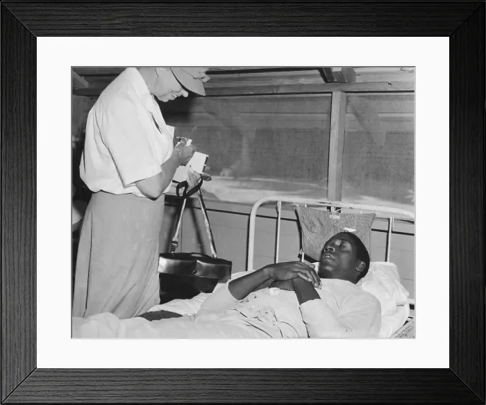 Framed Print : First Lady Eleanor Roosevelt visits a African American soldier in a South Pacific military hospital