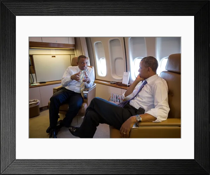 Framed Print : President Barack Obama with Transportation Sec. Anthony Foxx. They are aboard Air Force One during the flight to Jacksonville, Florida, July 25, 2013. (BSLOC_2015_13_246)