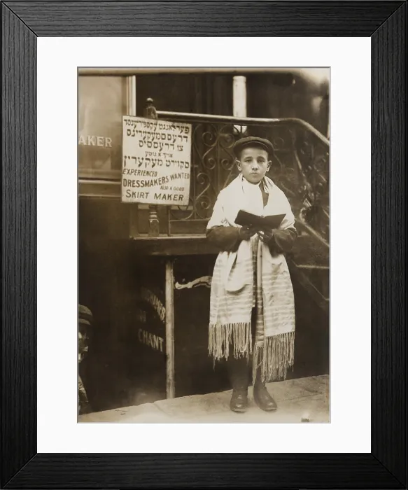 Framed Print : Jewish boy wearing a prayer shawl and boy reading from a Hebrew Bible on Yom Kippur, on a New York City street in a Jewish neighborhood. Ca.1911