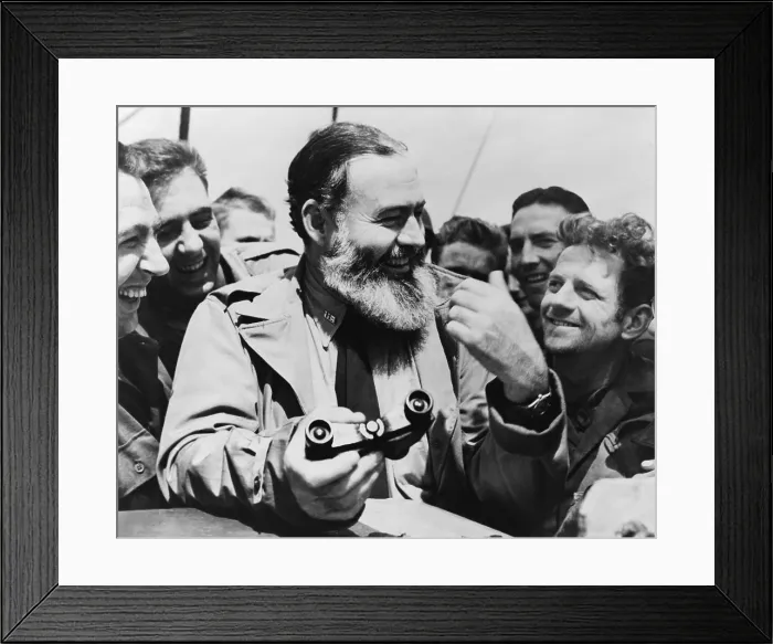 Framed Print : Ernest Hemingway, holding binoculars and surrounded by admirers, 1959. He had recently completed THE MOVEABLE FEAST, his memoir of Paris in the 1920s (BSLOC_2016_11_149)