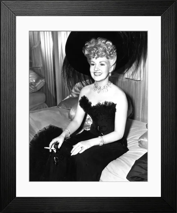 Framed Print : CONEY ISLAND, Betty Grable, having a smoke on-set, 1943, TM and Copyright 20th Century Fox Film Corp. All rights reserved. Courtesy: Everett Collection
