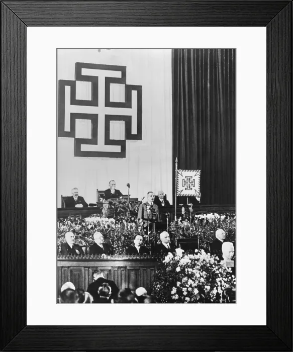 Framed Print : Under emblem of the Fatherland Front of Austria, Chancellor Kirt Schuschnigg speaks to parliament