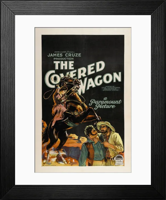 Framed Print : THE COVERED WAGON, background, left: Lois Wilson on horse; foreground bottom, left to right: Alan Hale Sr. Ernest Torrence, 1923 Framed Print : THE COVERED WAGON, background, left: Lois Wilson on horse; foreground bottom, left to right: Alan Hale Sr. Ernest Torrence, 1923