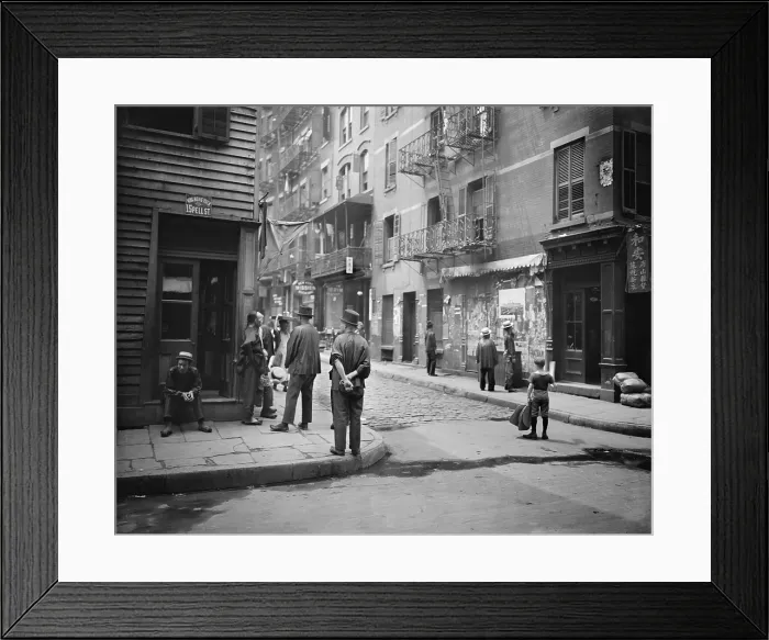 Framed Print : Pell Street in New York City's Chinatown with several Chinese men in traditional dress, one with his hair in the Han Chinese queue, a waist-long, braided pigtail. Ca. 1900 Framed Print : Pell Street in New York City's Chinatown with several Chinese men in traditional dress, one with his hair in the Han Chinese queue, a waist-long, braided pigtail. Ca. 1900