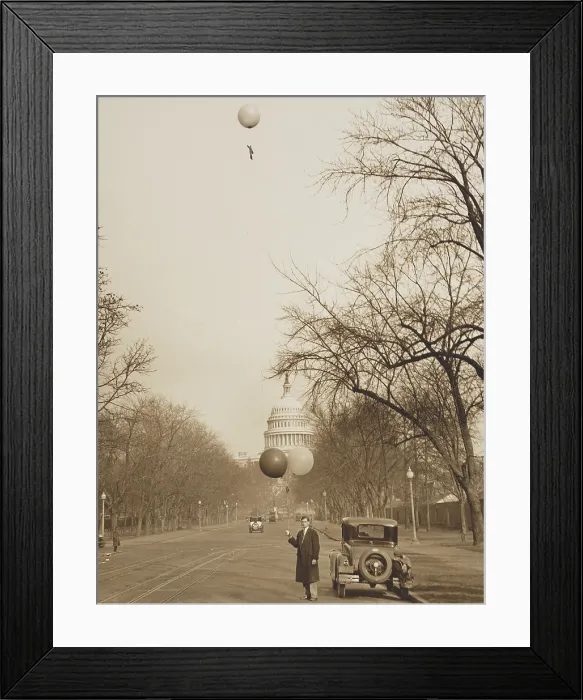 Framed Print : J.E. Woods, of the U.S. Army Signal Corps, about to release a second balloon, Jan. 1931. He was protesting the location of the new Army & Navy Building. U.S