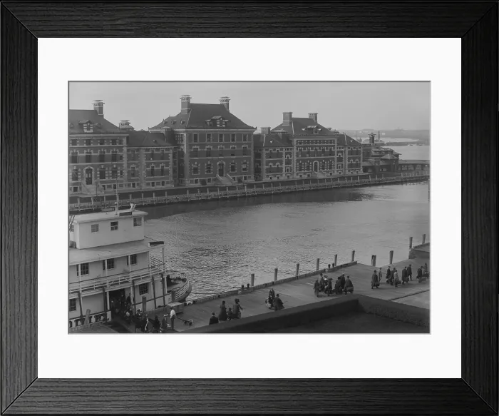 Framed Print : Well dressed immigrants arriving via Ferry at New York's Ellis Island. Ferries transported passengers from their Ocean going ship to the immigrant inspection station. Ca. 1910 Framed Print : Well dressed immigrants arriving via Ferry at New York's Ellis Island. Ferries transported passengers from their Ocean going ship to the immigrant inspection station. Ca. 1910