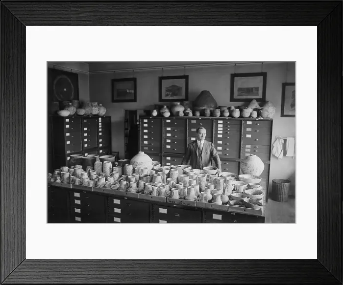Framed Print : Neil Merton Judd standing with Native American pottery at the Smithsonian Institution, 1924