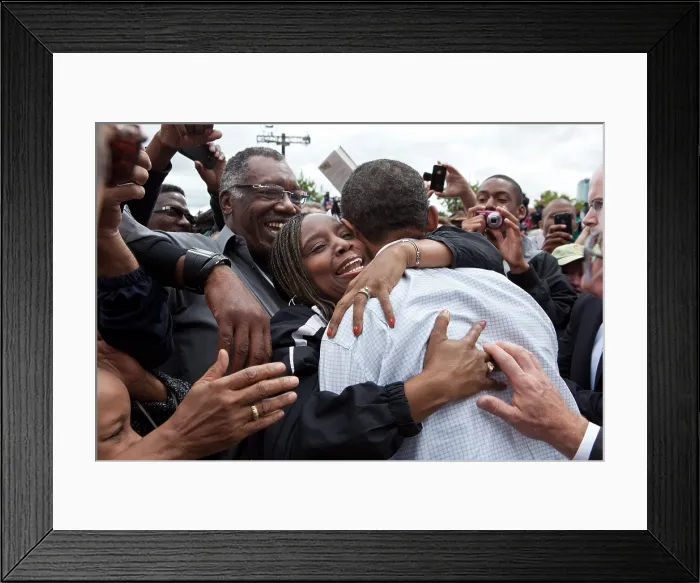 Framed Print : President Barack Obama is hugged by a woman during a Labor Day celebration. Sept. 5, 2011 (BSLOC_2015_3_87) Framed Print : President Barack Obama is hugged by a woman during a Labor Day celebration. Sept. 5, 2011 (BSLOC_2015_3_87)