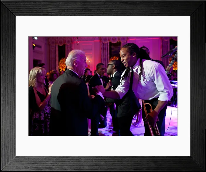 Framed Print : Vice President Joe Biden greets Lance Powlis, a trumpet player in Janelle Monae's band. The group performed in the State Dining Room of the White House, Oct. 13, 2011