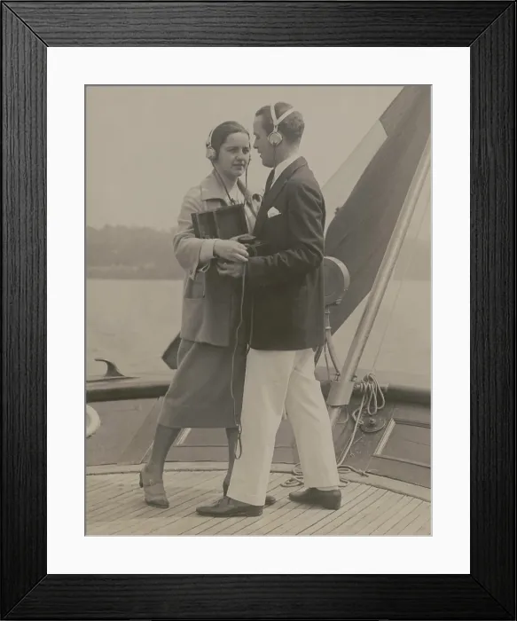 Framed Print : A young couple equipped with a portable radio outfit dancing to a broadcasted fox trot