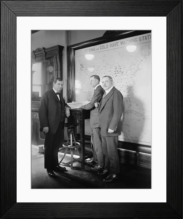 Framed Print : Meteorologists at the U.S. Weather Bureau stand in front of a map of the 48 states in 1924. Their map it titled, Warm and Cold Wave Warning Stations Framed Print : Meteorologists at the U.S. Weather Bureau stand in front of a map of the 48 states in 1924. Their map it titled, Warm and Cold Wave Warning Stations