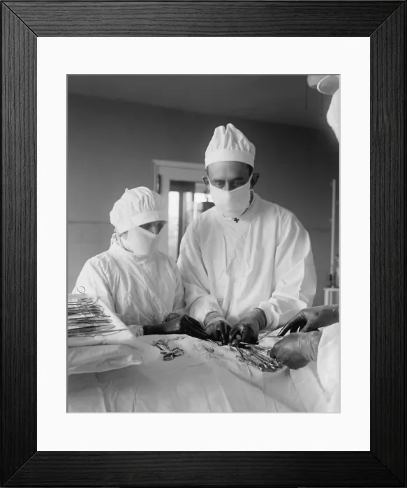 Framed Print : Assisting surgeon and surgical nurse with specialized instruments during an operation. Blood can be seen in surgical area. 1922 in a hospital in Washington, D.C