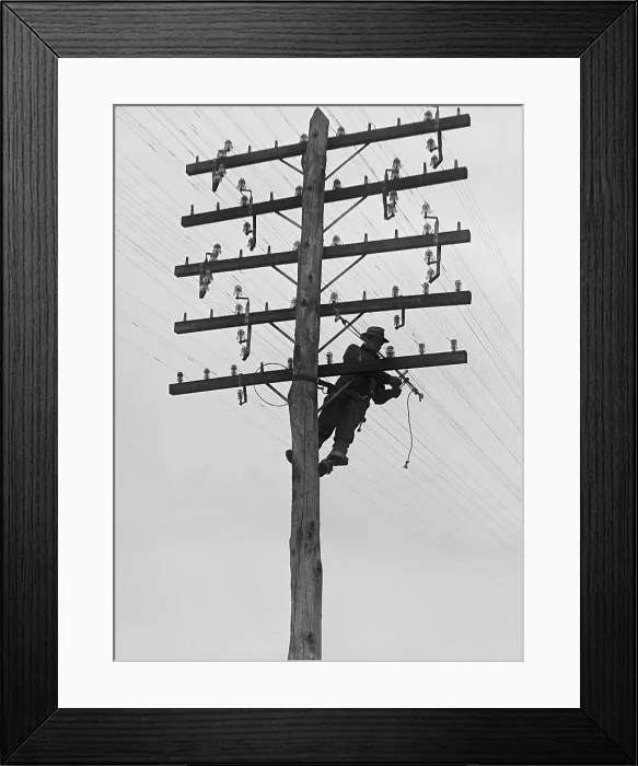 Framed Print : Chesapeake and Potomac Telephone Company lineman at work in 1929. Installation and maintenance of utility lines created a new category of technical jobs (BSLOC_2016_10_38)