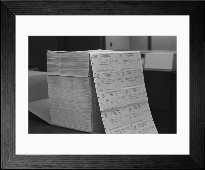 Framed Print : Large stack of computer generated welfare checks at a New York City welfare office. May 24 1976 Framed Print : Large stack of computer generated welfare checks at a New York City welfare office. May 24 1976