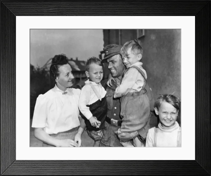Framed Print : Discharged German soldier Fritz Reidel returned to his wife and children, May 21, 1945. U.S. military began discharging German soldiers after medical exams and fingerprinting Framed Print : Discharged German soldier Fritz Reidel returned to his wife and children, May 21, 1945. U.S. military began discharging German soldiers after medical exams and fingerprinting
