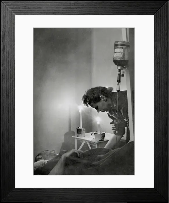 Framed Print : American Army nurse at candle lit bedside of wounded soldier in France during World War 2 Framed Print : American Army nurse at candle lit bedside of wounded soldier in France during World War 2