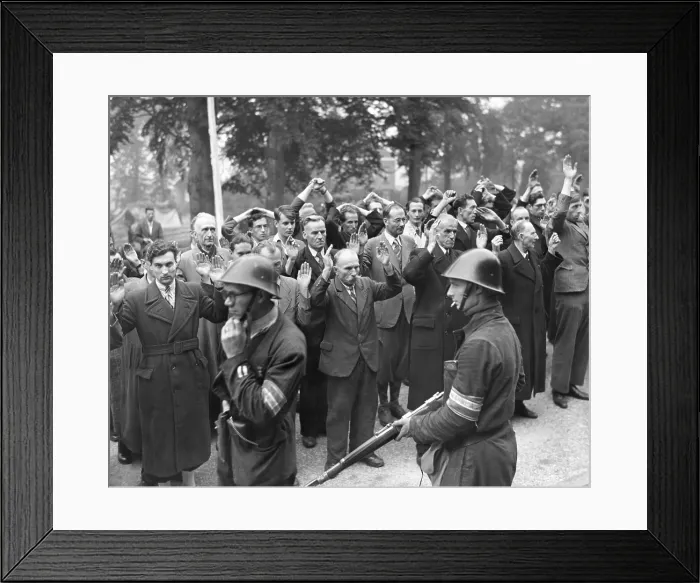 Framed Print : Collaborators with Nazi German occupiers under arrest by in Nijmegen, Holland. The city was liberated by American Airborne troops during Operation Market Garden. Sept. 20, 1944