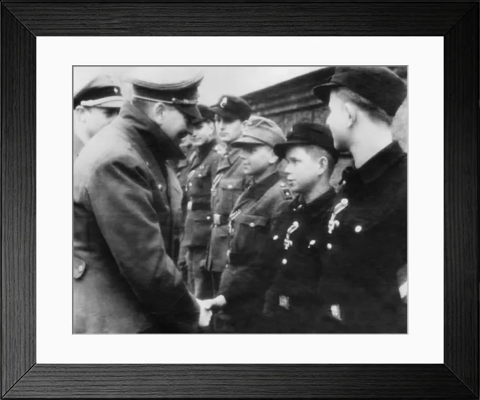 Framed Print : Hitler decorates a 12-year-old boy soldier with the iron Cross, second-class Framed Print : Hitler decorates a 12-year-old boy soldier with the iron Cross, second-class
